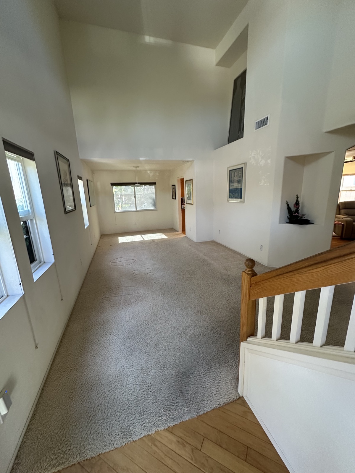 Before: carpeted living room with dated finishes ahead of a whole-home renovation