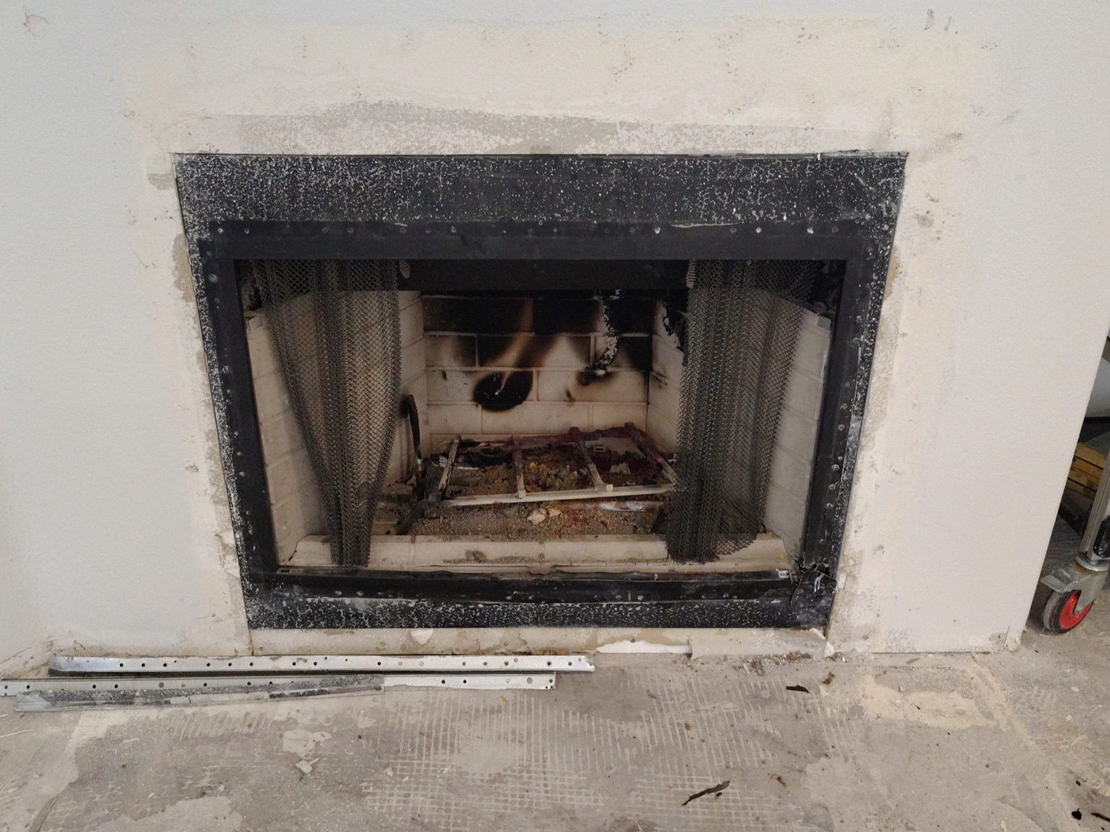 Before: fire-damaged fireplace stripped to the block during renovation