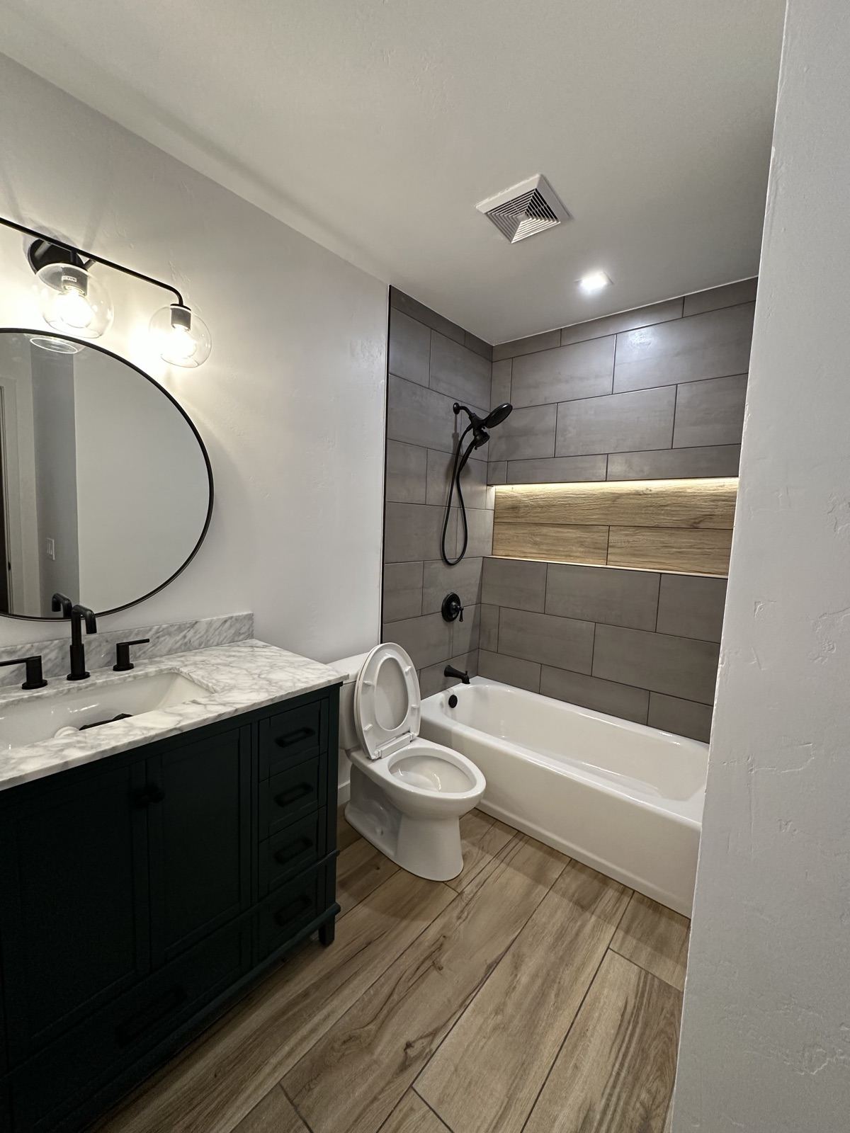 Vanity-to-tub view of the finished Lakeside bathroom remodel