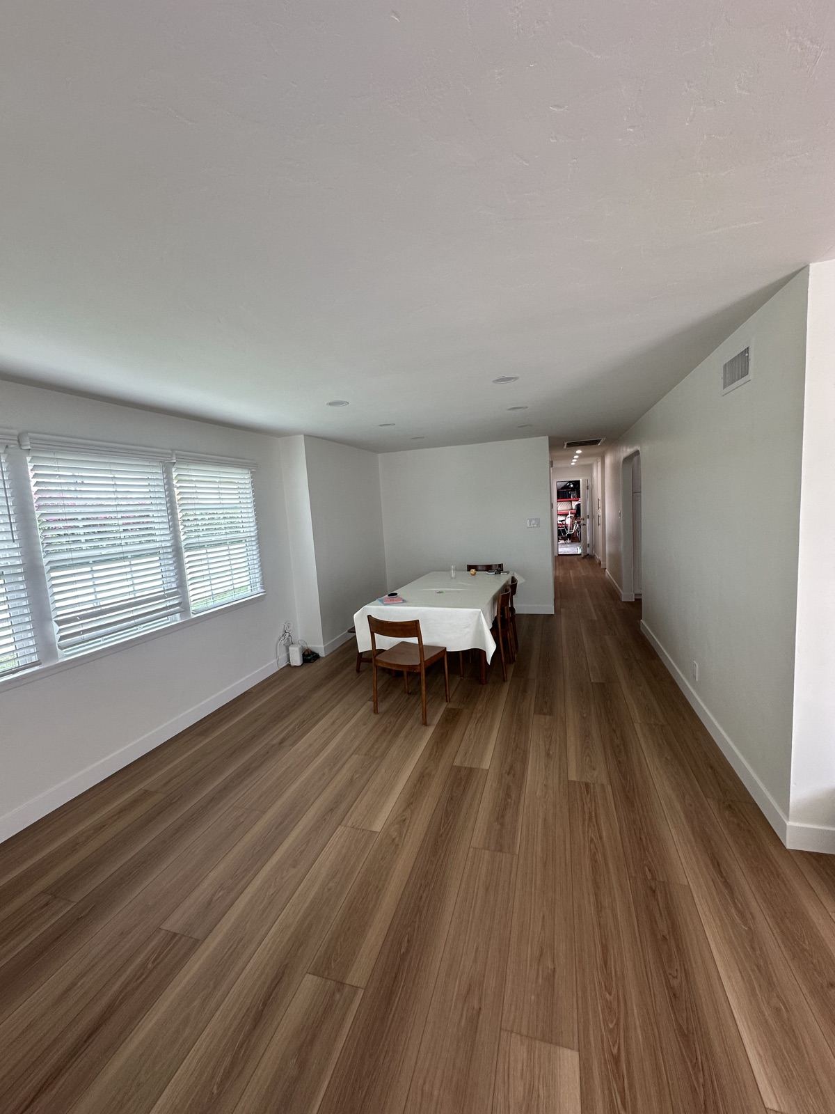 Finished room with new flooring and natural light in the Oceanside remodel