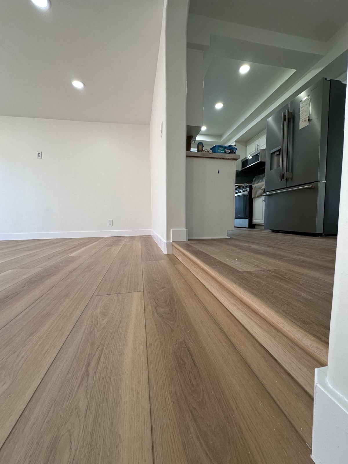 Open dining area flowing into the kitchen after the Oceanside whole-home remodel