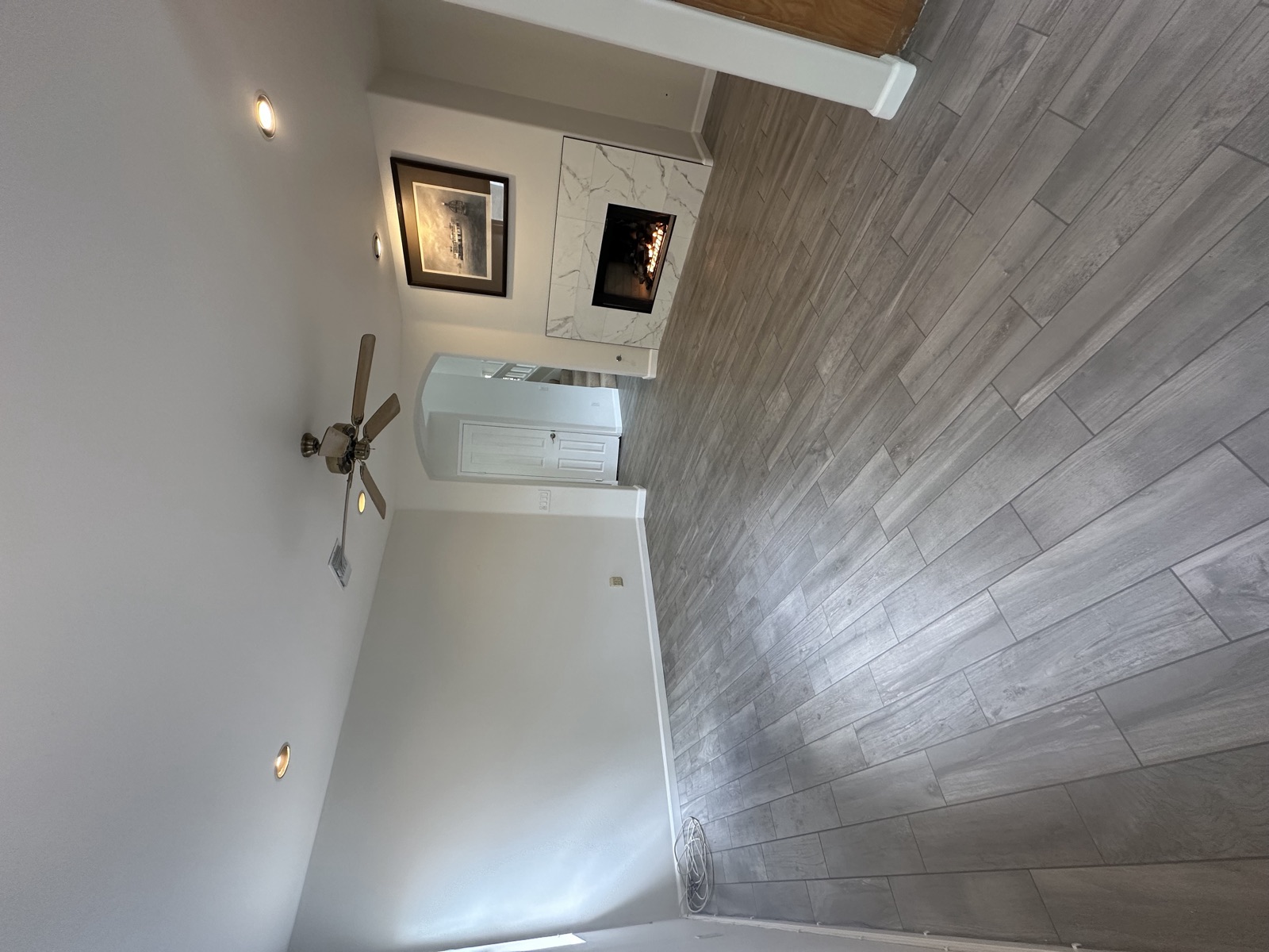 Finished family room with marble fireplace after a first-floor remodel in Poway